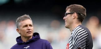 MELBOURNE, AUSTRALIA - JULY 20: Justin Longmuir, Senior Coach of the Dockers speaks with Mason Cox of the Magpies ahead of the round 19 AFL match between Collingwood Magpies and Fremantle Dockers at Melbourne Cricket Ground on July 20, 2025 in Melbourne, Australia. (Photo by Robert Cianflone/Getty Images)