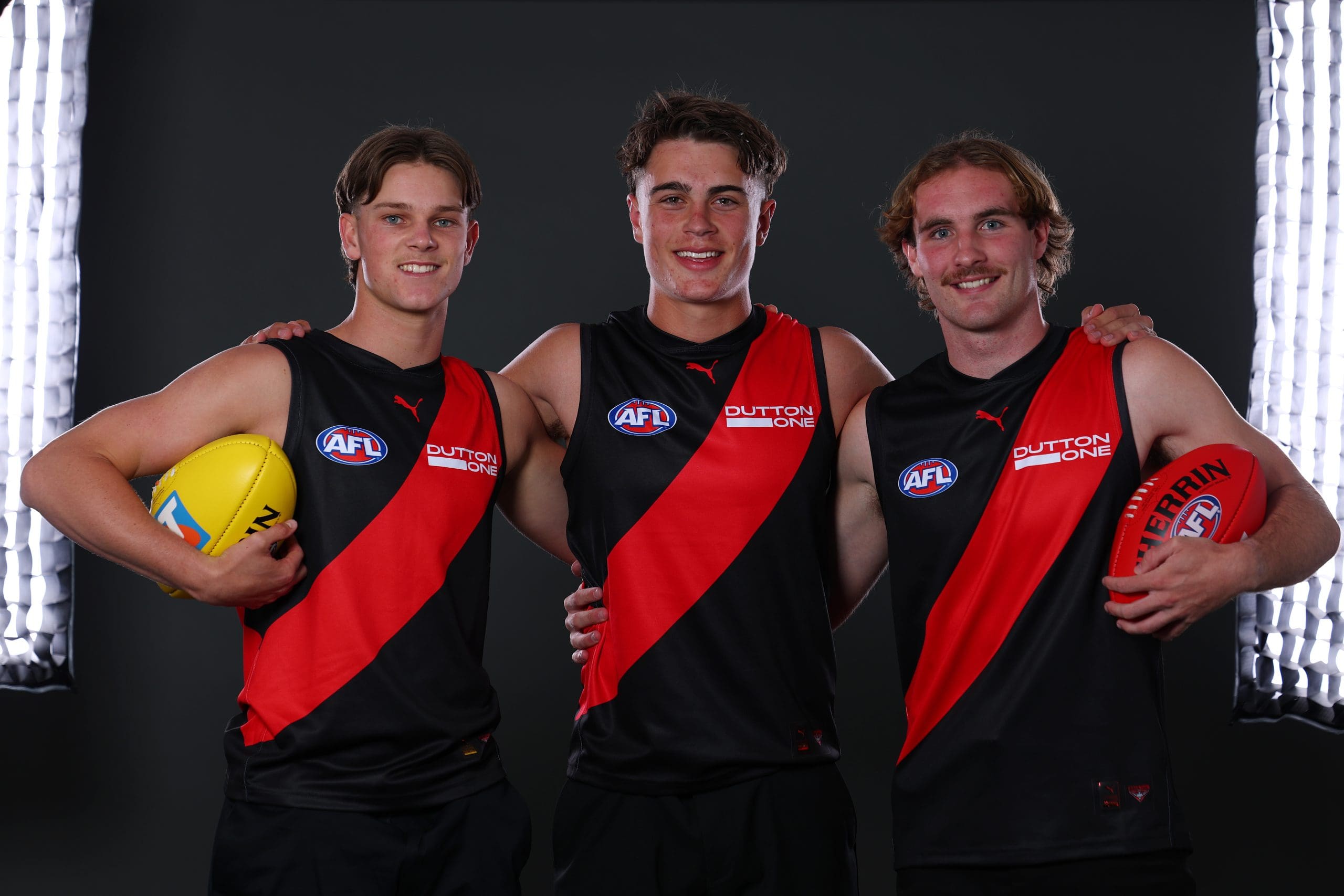 MELBOURNE, AUSTRALIA - NOVEMBER 19: Jacob Farrow, Sullivan Robey and Dyson Sharp pose after being selected by the Bombers as part of the 2025 Telstra AFL Draft at Marvel Stadium on November 19, 2025 in Melbourne, Australia. (Photo by Morgan Hancock/Getty Images)