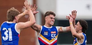 MELBOURNE, AUSTRALIA - SEPTEMBER 20: Sullivan Robey of the Eastern Ranges celebrates with teammates after the Ranges won the Coates Talent League Boys Grand Final between Eastern Ranges and Sandringham Dragons at Ikon Park on September 20, 2025 in Melbourne, Australia. (Photo by Asanka Ratnayake/AFL Photos)
