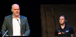 VARIOUS CITIES, AUSTRALIA - MARCH 18: Rodney Eade and Jessica Wuetschner prepare to unveil the new team colours during a media opportunity announcing the details for the Tasmanian AFL team, at Hobart Theatre Royal on March 18, 2024 in Various Cities, Australia. (Photo by Steve Bell/Getty Images)