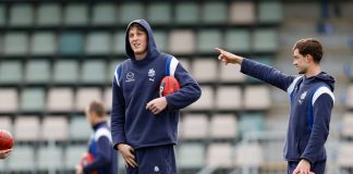 HOBART, AUSTRALIA - JULY 27: Jaidyn Stephenson, Nick Larkey and Jy Simpkin of the Kangaroos are seen before the 2024 AFL Round 20 match between the North Melbourne Kangaroos and the Geelong Cats at Blundstone Arena on July 27, 2024 in Hobart, Australia. (Photo by Dylan Burns/AFL Photos via Getty Images)