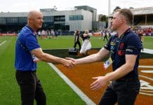 MELBOURNE, AUSTRALIA - NOVEMBER 22: Darren Crocker, Senior Coach of the Kangaroos and Mick Stinear, Senior Coach of the Demons shake hands during the 2025 AFLW First Preliminary Final match between the North Melbourne Tasmanian Kangaroos and the Melbourne Demons at Ikon Park on November 22, 2025 in Melbourne, Australia. (Photo by Michael Willson/AFL Photos via Getty Images)