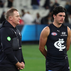MELBOURNE, AUSTRALIA - APRIL 16: Michael Voss, Senior Coach of the Blues and Elijah Hollands of the Blues after the game during the 2026 AFL Round 06 match between the Carlton Blues and the Collingwood Magpies at the Melbourne Cricket Ground on April 16, 2026 in Melbourne, Australia. (Photo by James Wiltshire/AFL Photos via Getty Images)