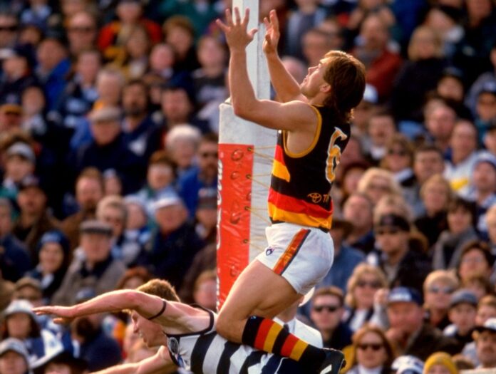 1998:  Tony Modra of Adelaide jumps to markthe ball during the Round 20 AFL Football match against Geelong in Adelaide, Australia.  Mandatory Credit: Hamish Blair /Allsport