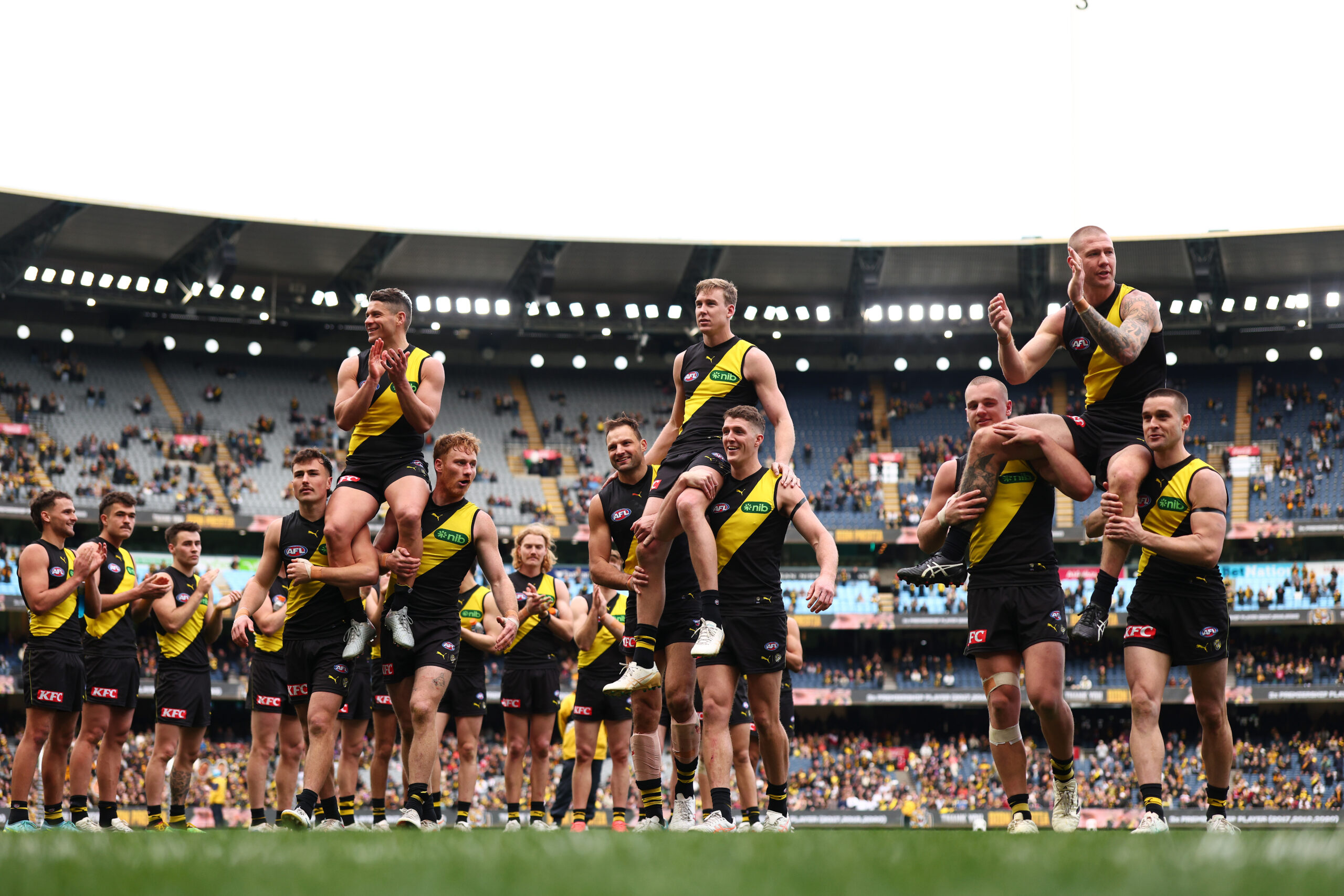 MELBOURNE, AUSTRALIA - AUGUST 15: (L-R) Dion Prestia, Tom Lynch and Nathan Broad of the Tigers are chaired off after playing their final game (Prestia and Broad) and 250th (Lynch) during the round 23 AFL match between Richmond Tigers and St Kilda Saints at Melbourne Cricket Ground, on August 15, 2026, in Melbourne, Australia. (Photo by Daniel Pockett/Getty Images)